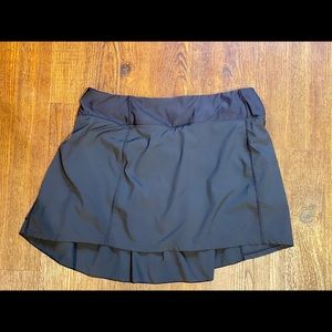 Mondetta women’s black pleated athletic skirt.